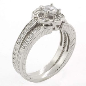 JACKET ANILLO CON CIRCONIA EN FORMA DE FLOR Y CIRCONIAS AL REDEDOR Y ARGOLLA AJUSTABLE CON CIRCONIAS 1-07581